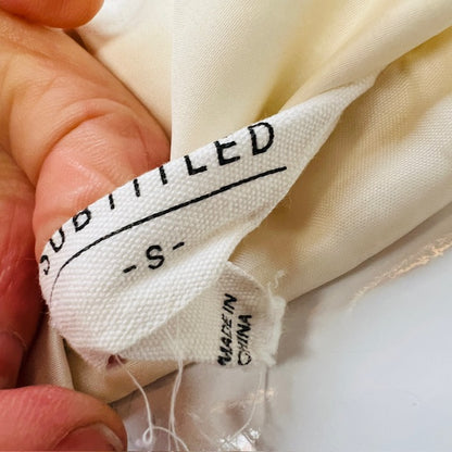 SUBTITLED / oversized white puffer vest / s (3885633187916801976)